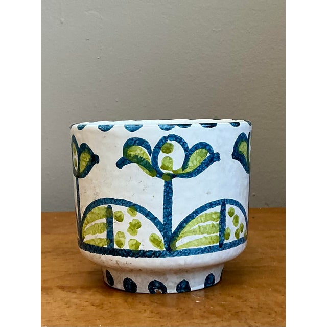 This charming Italian cache pot is a beautiful example of Mid-Century Modern ceramic art, embodying the playful yet...