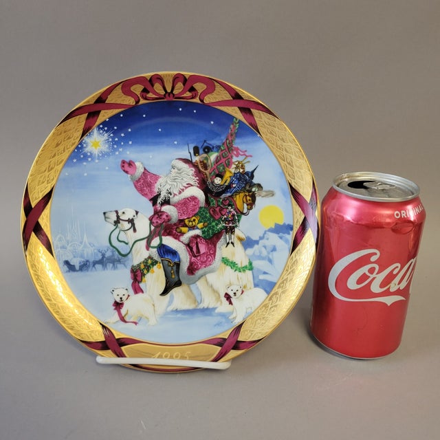 A richly detailed 1995 Bing & Grondahl collector plate from the Christmas Around the World series, featuring Santa...