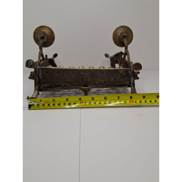 This is an authentic 19th-century Eastern European bench-style Chanukah lamp (Hannukiah), likely of Polish origin. The...