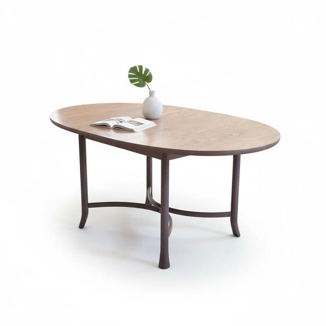 The Ercol mid-century table is a beautifully crafted piece designed to bring timeless elegance and practical style to your...