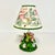 This is a sweet little table lamp from the 1980s. It features a lovely garden setting of pink and lavender pansies with a...