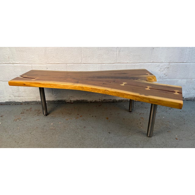 Make a statement with this stunning handcrafted live edge walnut coffee table, featuring a one-of-a-kind natural slab top...