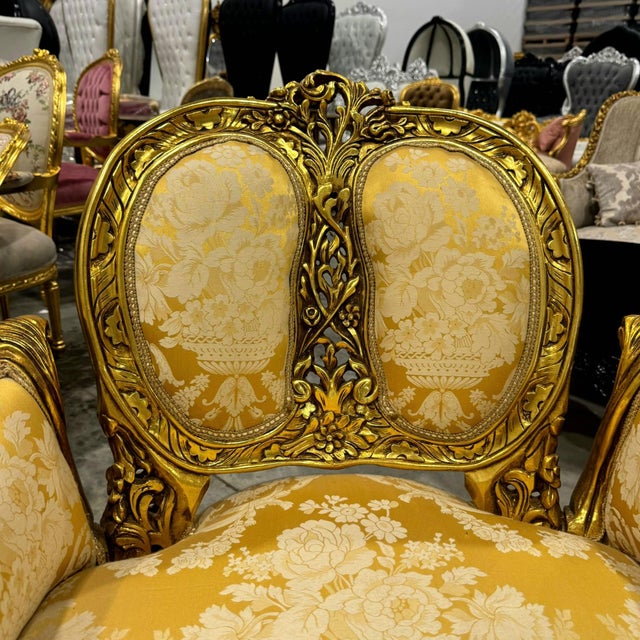 Elevate your space with this stunning gold armchair in the style of French Rococo, a true statement of elegance and...
