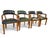 A set of four armchairs in green leather with a curved, button-tufted back and brass nailhead trim. Solid wood frames with...