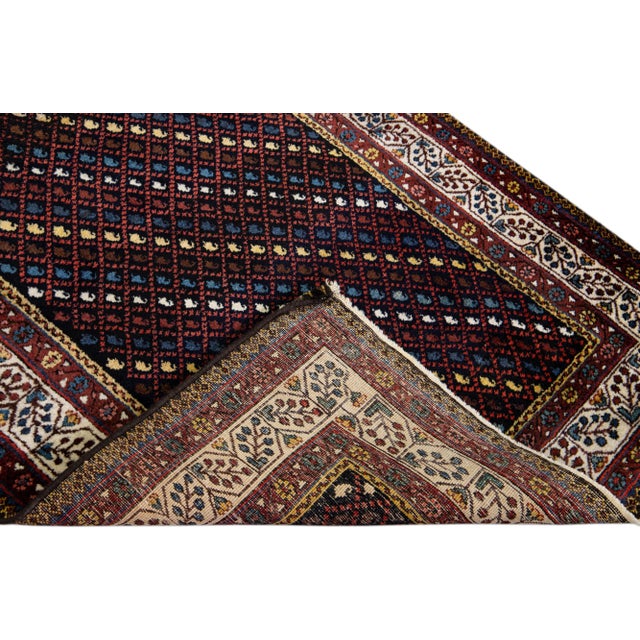Beautiful modern Kurd hand-knotted wool runner with a dark blue field. This piece has multicolor accents in a gorgeous...