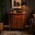 A distinguished English Regency style faux book bar cabinet, thoughtfully crafted in the manner of Theodore...