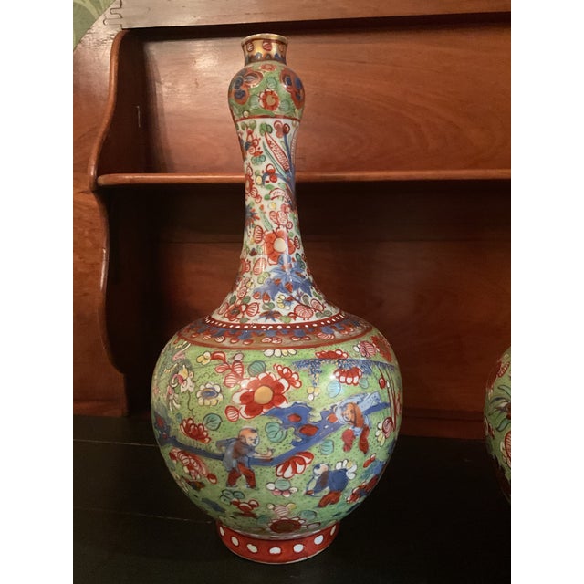 LIKE pair of early Chinese Export 19th Century Clobbered porcelain vases. The vases were originally blue and white later...