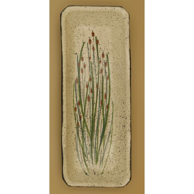 A harmonious pair of mid-century studio pottery platters by Jobi Studio Pottery, produced on Cape Cod and signed to the...