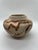 This exquisite Nemadji Indian swirl pottery piece showcases a beautiful tan base color with elegant brown accents. The...