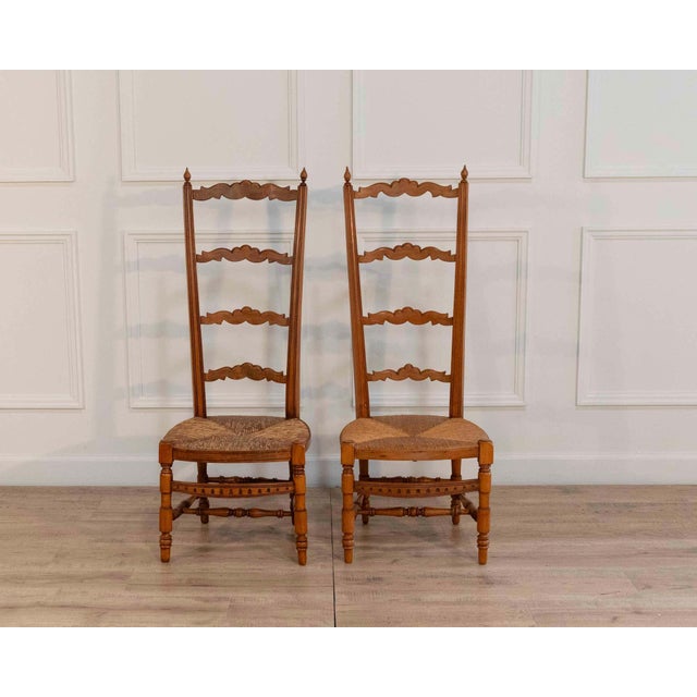 A charming pair of 19th-century French Provençal nurse’s chairs, distinguished by their notably low seats, a form...