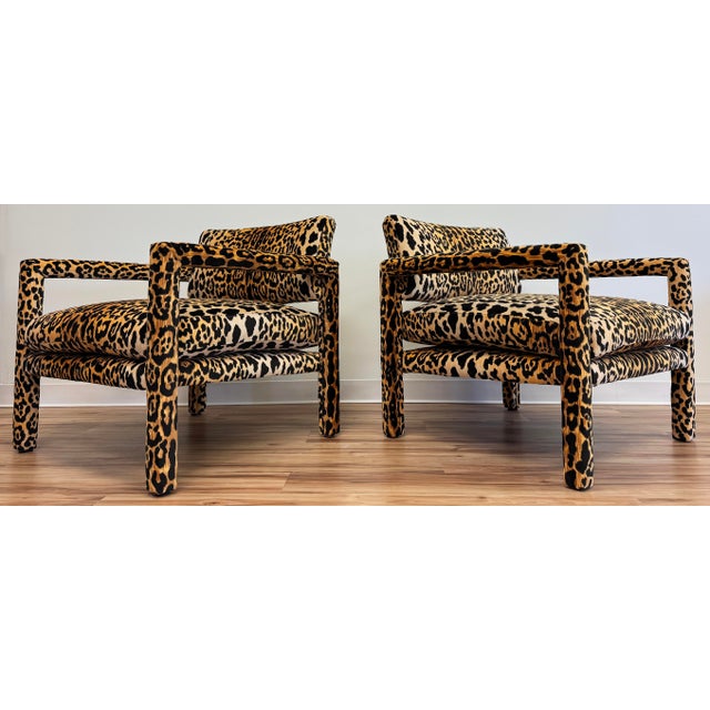 Pair of vintage parsons style club chairs in a rich leopard print velvet upholstery. Solid wood frames with brand new...