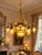 1970 French Artisan Louis XVI Gold Bronze Chandelier For Sale - Image 4 of 18