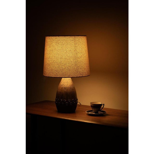 Danish ceramic table lamp with old shade. This stylish lamp is marked at the bottom and is in good vintage condition....