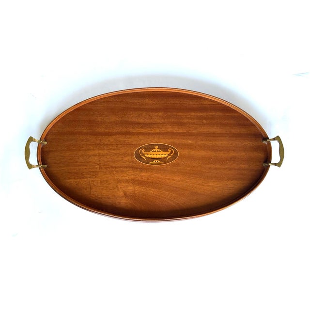 the antique serving tray by Manning Bowman & Co. (Meriden,Connecticut, 1849-1945) dating from the early 20th Century...