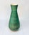 A large elegant floor vase, handcrafted in Italy during the 1950s, glazed in turquoise and a soft yellow on the inside....