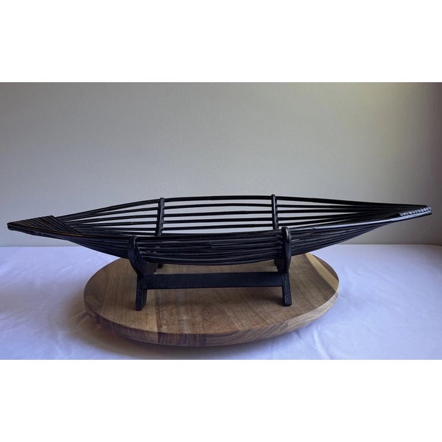 Make a statement with this unique vintage wicker rattan boat-shaped centerpiece basket. Beautifully crafted with woven...