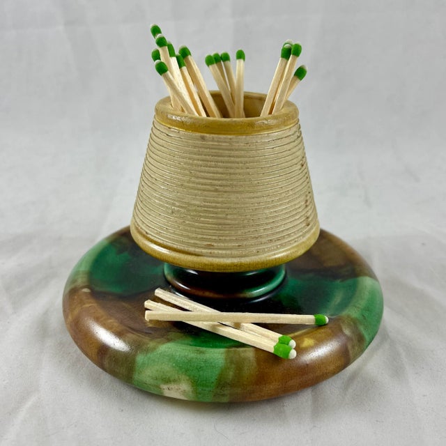 A Wedgwood Majolica earthenware pottery match holder and striker, Staffordshire, England – circa 1869. For the hearth,...