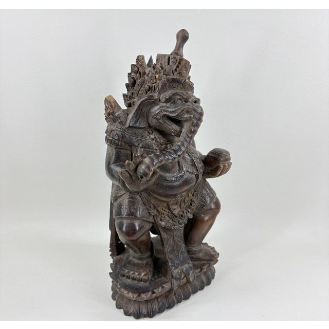 Detailed 12" Vintage Balinese Hand-Carved Ganesha Wood Sculpture A masterful example of traditional Balinese artistry,...