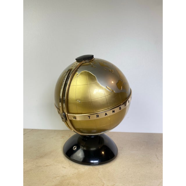 Vintage novelty transistor radio by Vista, model NTR-6G, made in Japan. Designed as a tabletop globe in gold and silver...