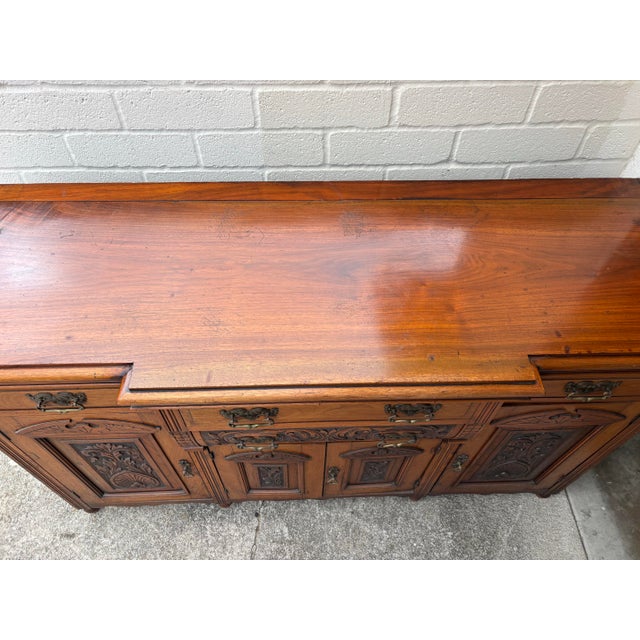 Brown Antique Victorian Walnut Sideboard Featuring Intricate Hand Carvings and Original Ornate Brass Hardware For Sale - Image 8 of 12