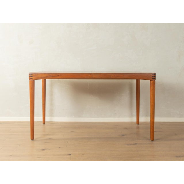 Rare extendable teak dining table from the 1960s by H.W. Klein for Bramin. Solid wood frame and veneered tabletop with a...
