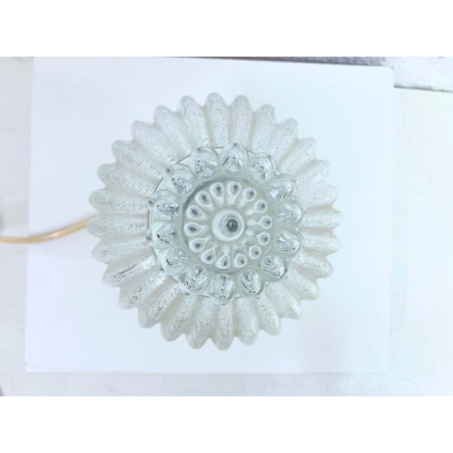 1 table lamp from the 1970s and 1980s. Glass, plastic. Good used condition. Light wear. 21 x 14 cm This piece has an...