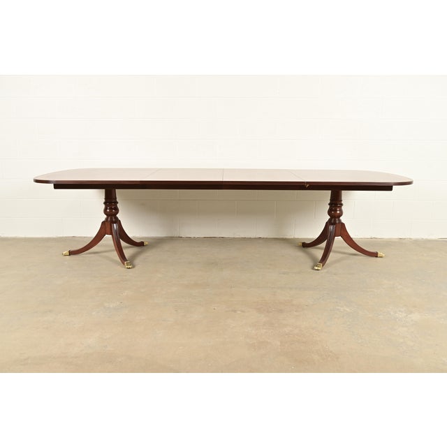 An exceptional Georgian or Regency style double pedestal extension dining table By Ethan Allen USA, Circa 1980s Gorgeous...