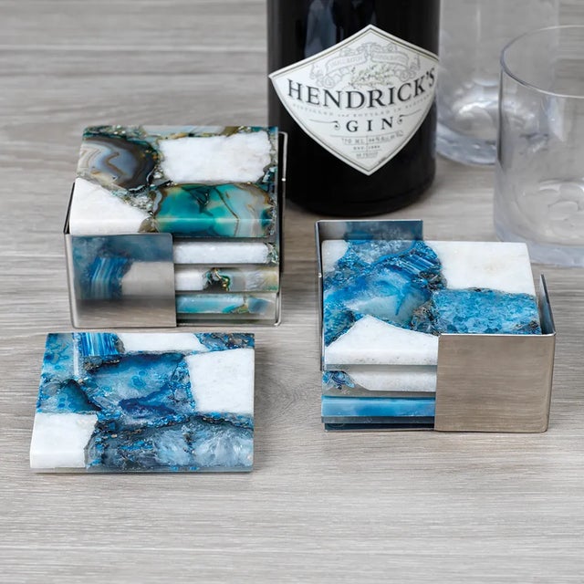 Your home should be accessorized as thoughtfully as your outfit. Our 4-set of agate coasters are an instant conversation...