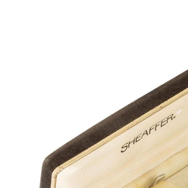 Sheaffer pen and mechanical pencil set. American; vintage 1940s/50s; Snorkel model in a case with a 14kt gold-plated...