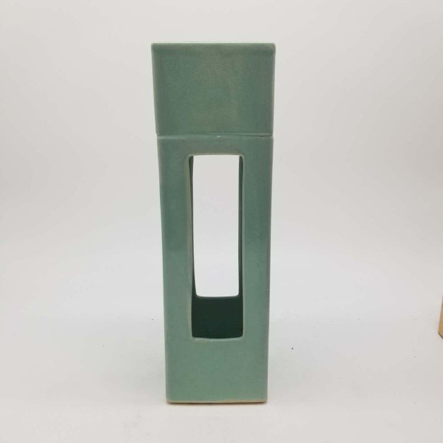 This is a vintage Japanese celadon ceramic vase bearing a label marked “Sankō (三晃)”. The vase features a distinctive...