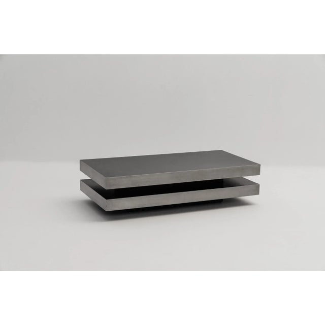 Vintage coffee table in top mint condition. Its sleek and minimalist structure is striked by horizontal lines and balanced...