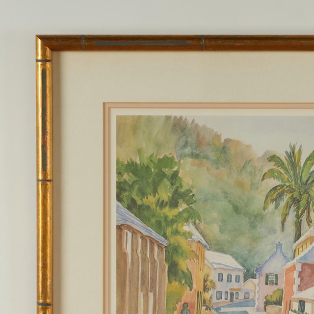Inspired lithographic print of a watercolor depicting a street with houses in a lush tropical setting. Pencil signed by...