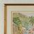 Inspired lithographic print of a watercolor depicting a street with houses in a lush tropical setting. Pencil signed by...