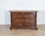 A distinguished 17th-century Tuscan chest of drawers, crafted in solid and veneered walnut with elegant maple thread...