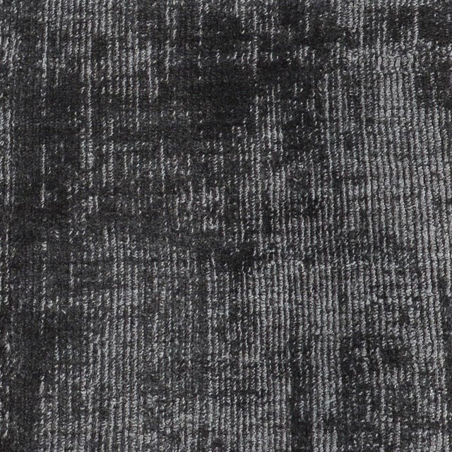 Soft luxurious charcoal gray silk-like viscose-cotton rug. Lightly distressed finish for texture and dimension. Available...