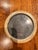 Charming pair of vintage round picture frames featuring a classic brass-tone finish and velvet-covered easel backs. Their...