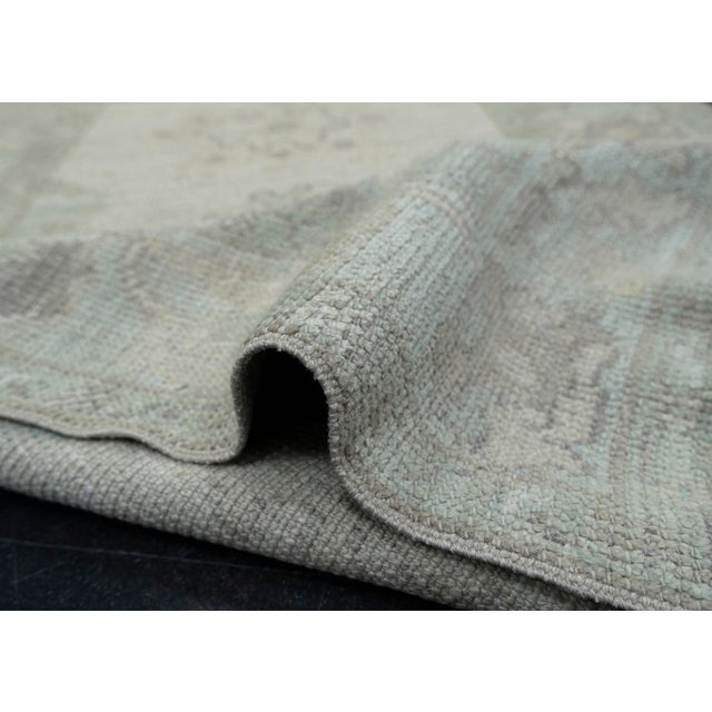 Turkish Oushak Rug Sage, Soft Gray & Ivory Handwoven Rug 3' X 5' This handwoven rug is crafted from 100% wool, featuring a...