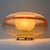A refined and elegant pair of lenticular/disc-shaped table lamps, produced in Italy in the 1970s and attributed to the...