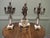 19th Century French Signed Bronze Clock and Garniture. A 19th Century French bronze mantle clock and candelabra garniture....