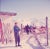 Mountain Top 1951 A skier checks their skis at a mountain top terrace, Klosters, Switzerland, 1951. Toni Frissell...