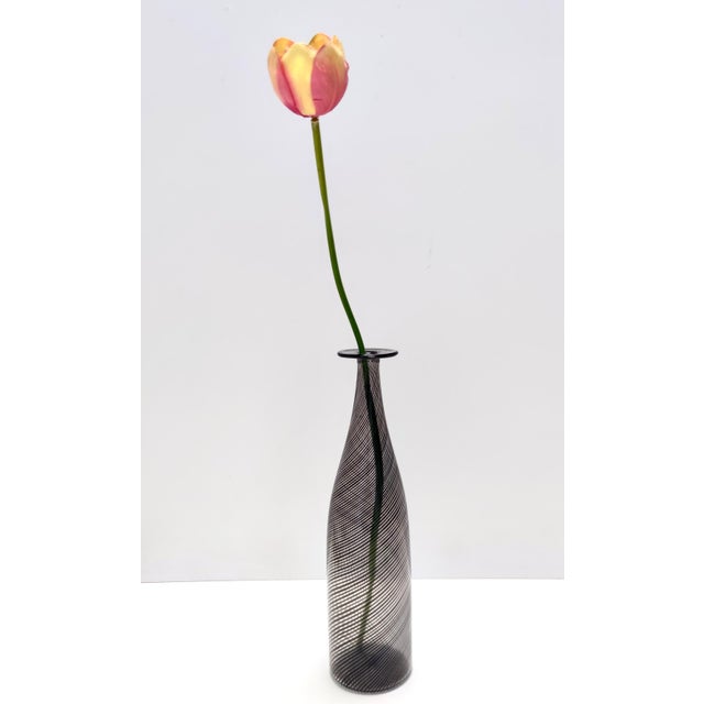 Made in Italy, 1950s - 1960s. This wonderful vase / bottle is made in black and transparent mezza filigrana Murano hand-...