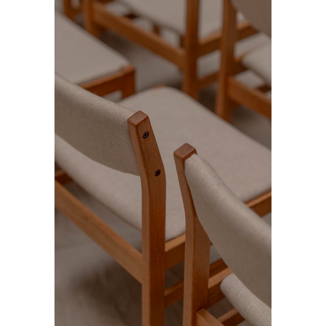 Rare large set of eight dining chairs designed by Børge Mogensen for FDB Møbler, Denmark. Crafted from solid oak, these...