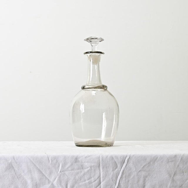 A charming 19th century handmade, blown glass decanter from the region of lower Normandy where Calvados apples are made...
