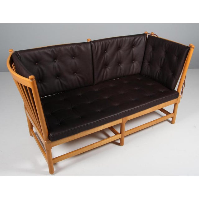 Børge Mogensen two-seat sofa in lacquered beech and new upholstered cushions of mokka full grain aniline leather. Model...