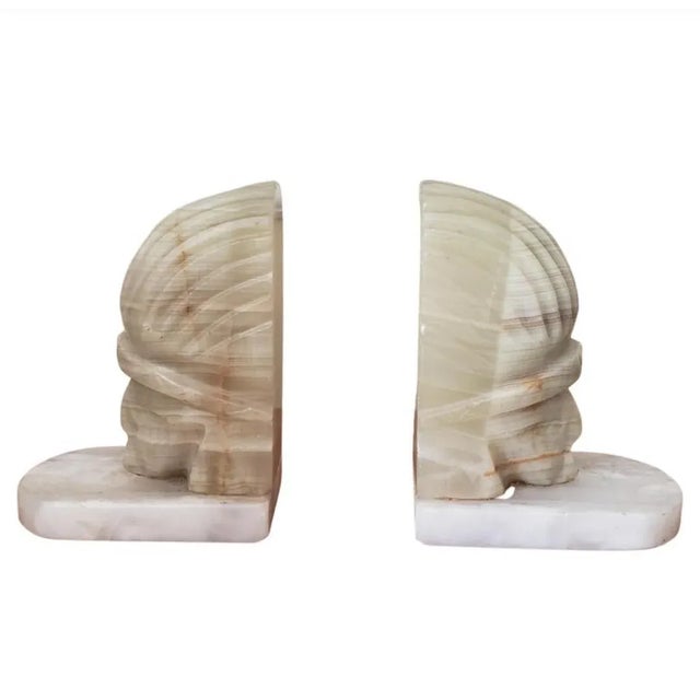 Fantastic pair of Onyx figural bookends. Measure 5" W x 5.25" H