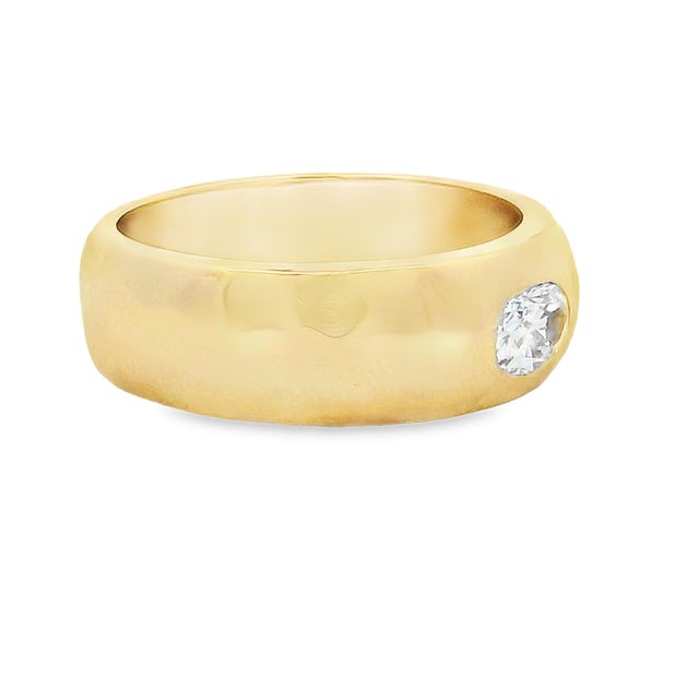 A quietly luxurious diamond band from Talia Jade, crafted in glowing 18K yellow gold with a gently rounded, sculptural...
