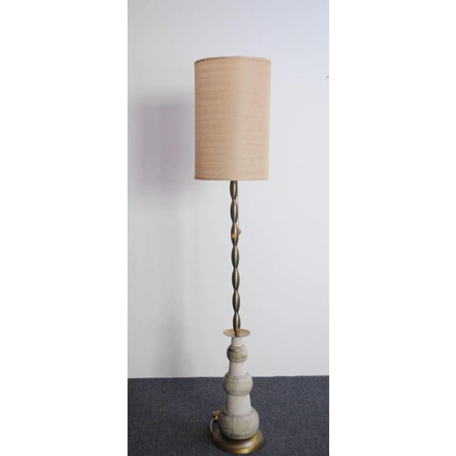 Glamorous and unique Hollywood Regency-Style floor lamp (ca. 1960s, USA). Composed of a graduated ceramic orb base...
