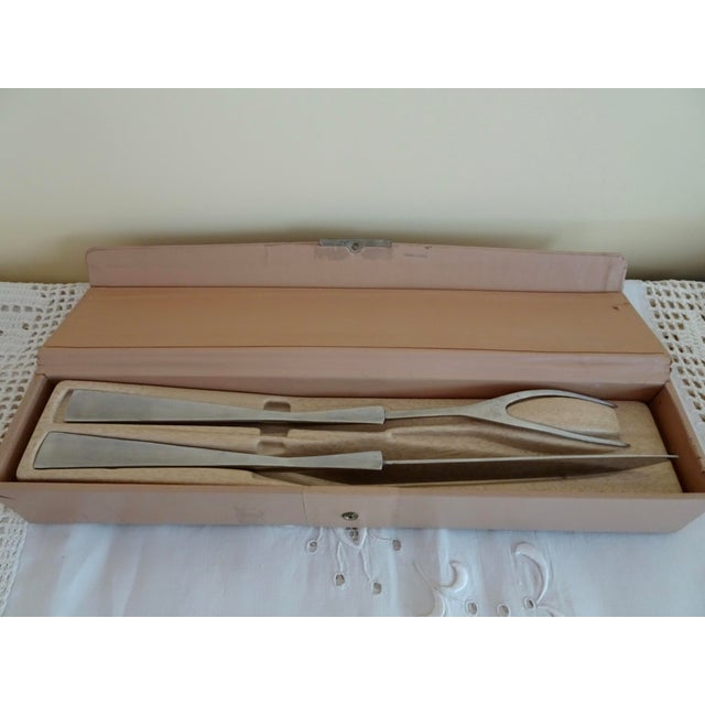 Mid-Century Modern stainless steel carving set with box is a great addition to your serving pieces. Both pieces are marked...