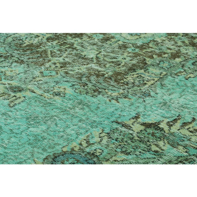 Made with hand-knotted wool and originating from Turkey circa 1960-1970, this 6x10 vintage rug is an exciting new piece in...