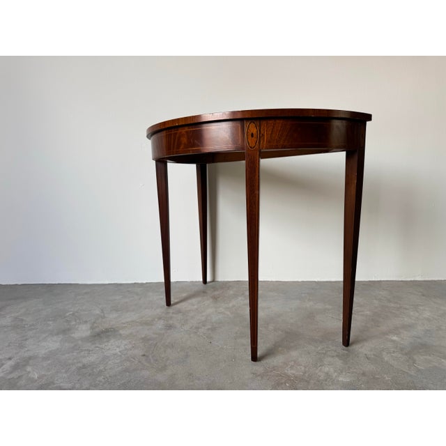 This elegant Vintage Century Furniture by Drexel Mahogany Demilune Console Table is a timeless piece that exudes...